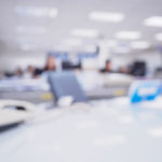 office blurred background with people working at desk